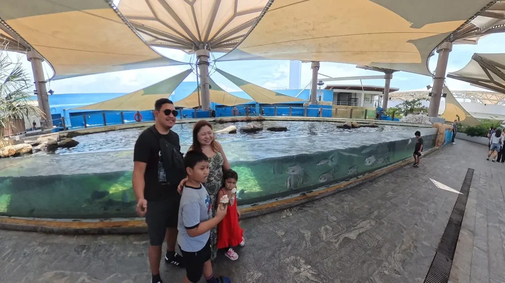 Family photo by the open-air fish pools on the Cebu Ocean Park rooftop